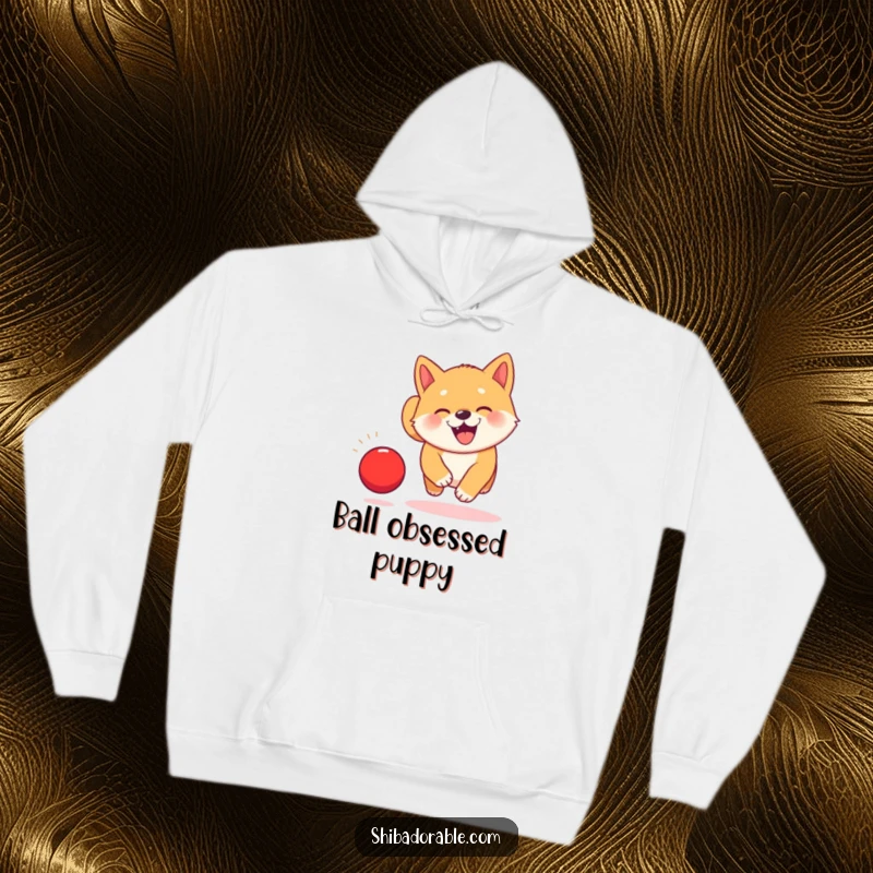Funny Kawaii Shiba Inu puppy hoodie, depicted joyfully chasing a bouncing red ball with an infectious, happy grin.