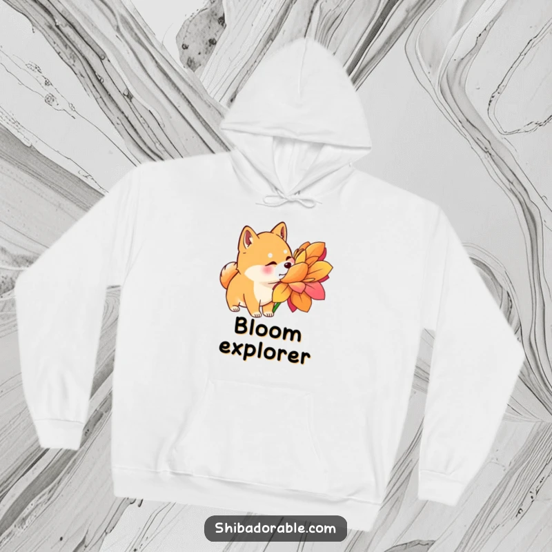 Funny Shiba Inu Hoodie: A Shiba Inu with perked ears curiously sniffs a large, brightly colored flower, embodying gentle exploration.