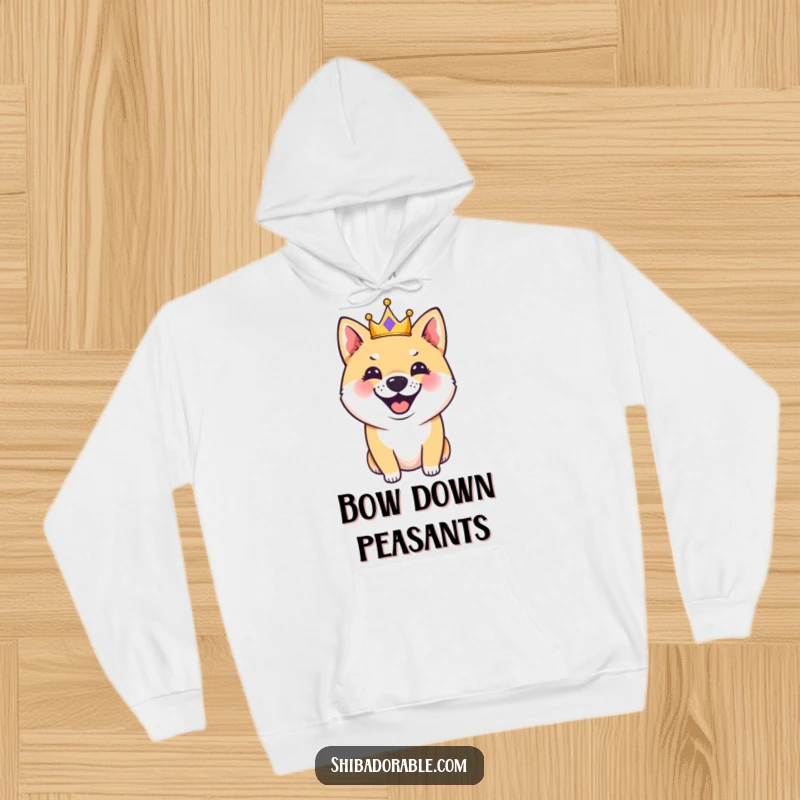 Funny Shiba Inu dog wearing a tiny crown, captured in the act of happily barking, on a soft hoodie, perfect for cozy laughs.