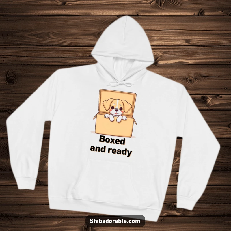 Funny dog hoodie depicting a dog comically spilling out of a large open box, floppy ears adding to the humorous effect.