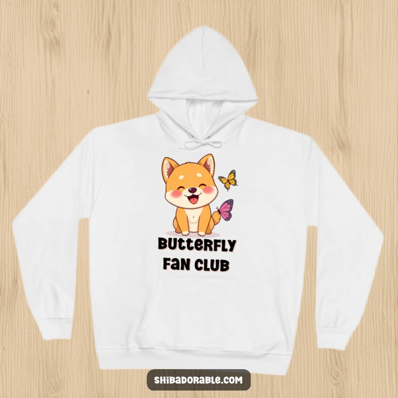 Funny Wagging Shiba Inu Butterfly Hoodie depicting a thrilled Shiba Inu dog excitedly greeting a small, beautiful butterfly.