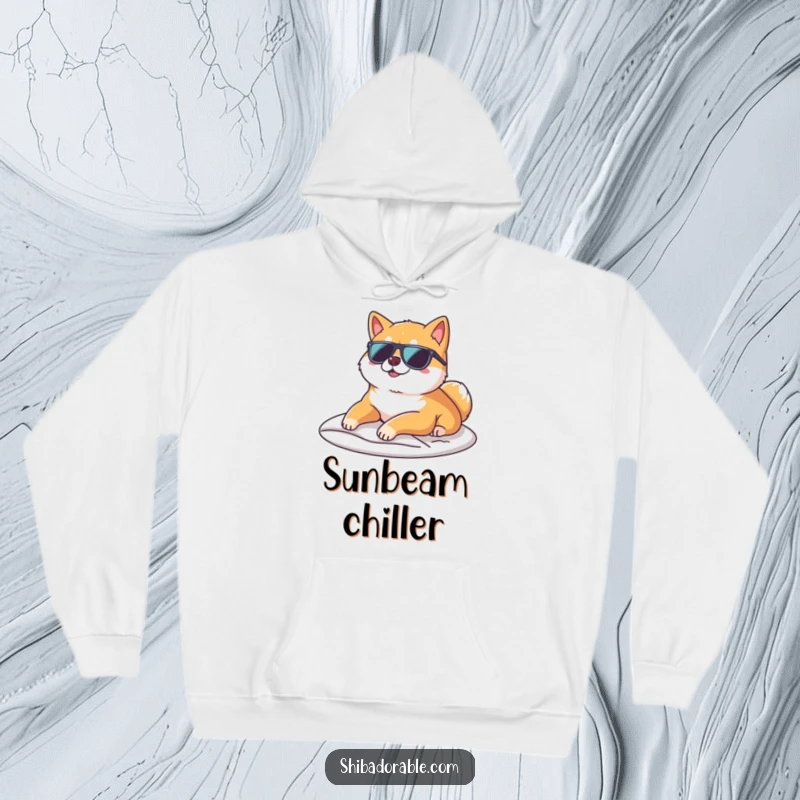 Funny Shiba Inu wearing sunglasses, lounging on a sunbeam, featured on a cozy hoodie for ultimate relaxation.
