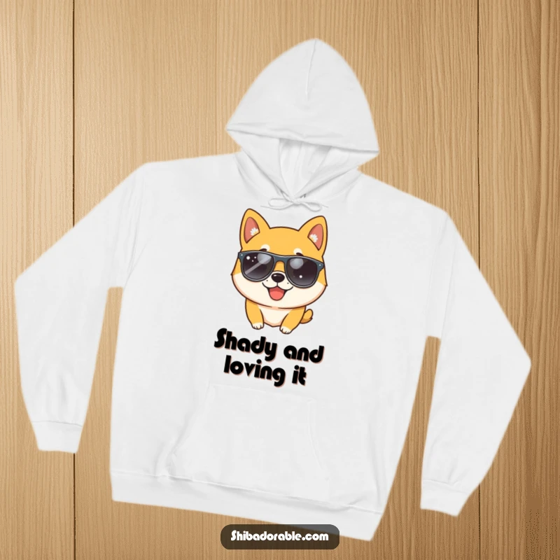Funny Shiba Inu dog wearing sunglasses and winking, printed on a warm hoodie, ideal for cool dog lovers seeking humor.