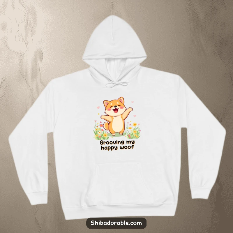 Funny Shiba Inu hoodie showing a dog joyfully dancing in a flower field, combining comfort with cheerful art.