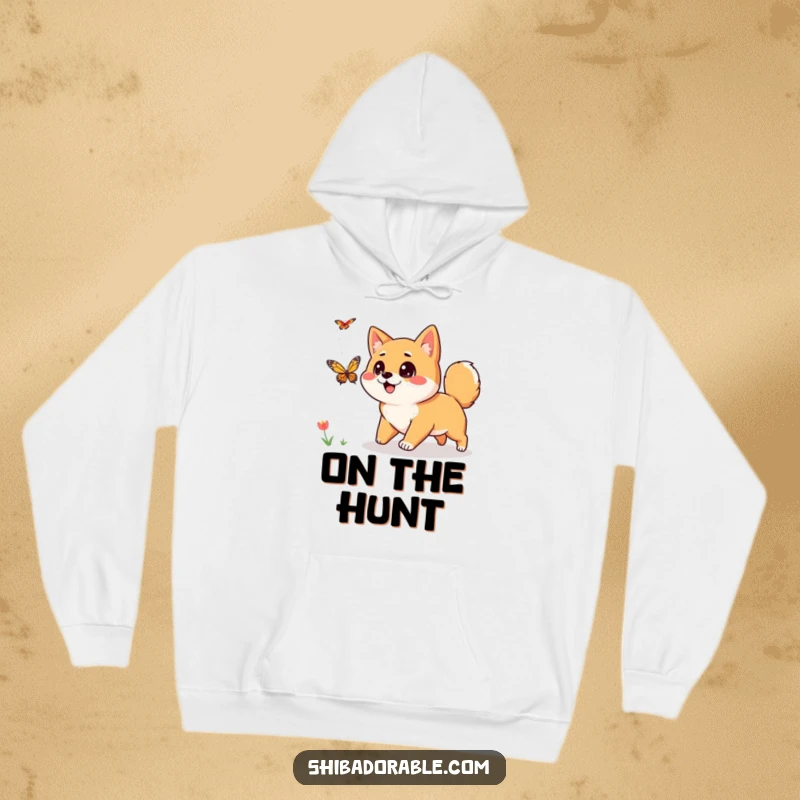 Funny Shiba Inu Hoodie: A curious Shiba Inu with big, expressive eyes chases a butterfly, a hilarious and heartwarming depiction.