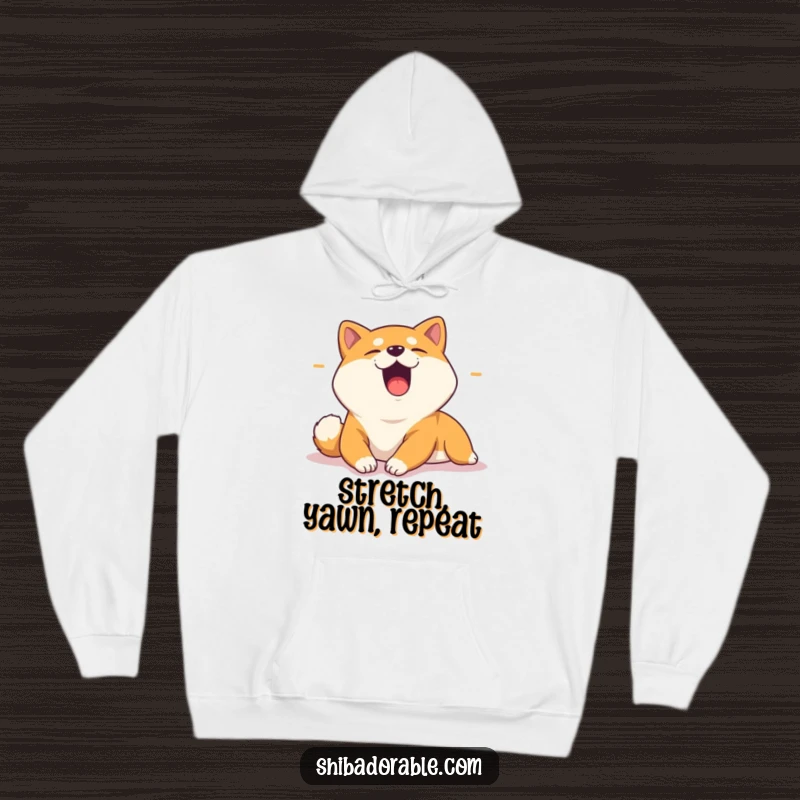 Funny hoodie featuring a yawning Shiba Inu stretching in a sunbeam, ideal for cozy relaxation and showcasing a love for lazy dogs.