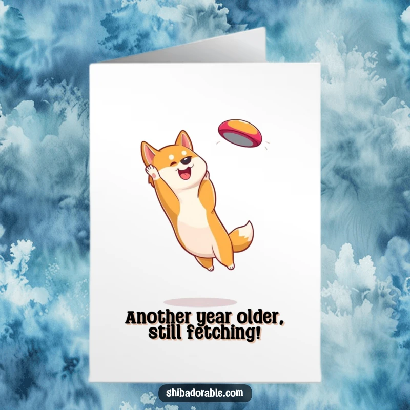 Funny Free Printable Birthday Card: A Shiba Inu dog catching a colorful frisbee mid-air with energetic focus.