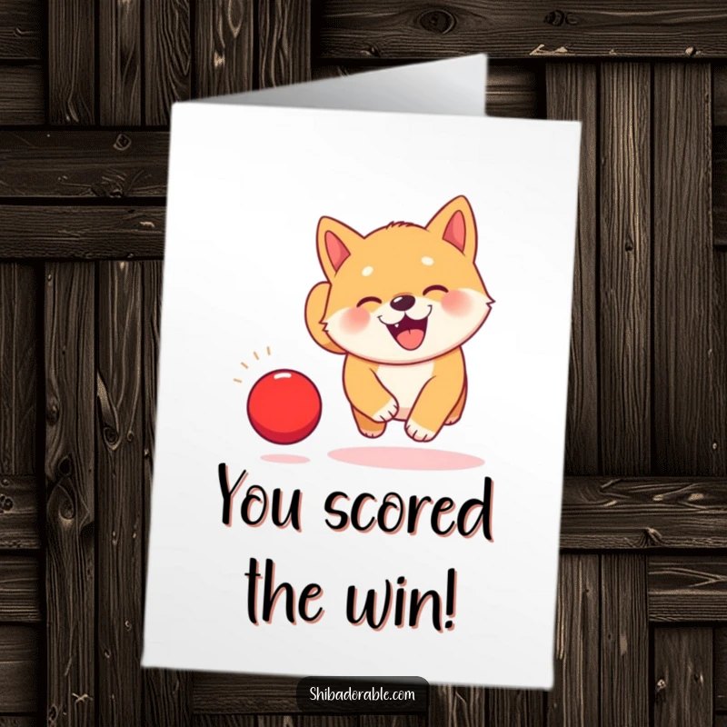 Free Printable congratulations card: A kawaii Shiba Inu puppy with ecstatic eyes gleefully chases a vibrant red ball mid-bounce.