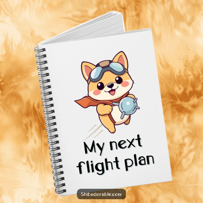 Funny Shiba Inu puppy in a pilot hat, ready to write, wings spread. A lined notebook.