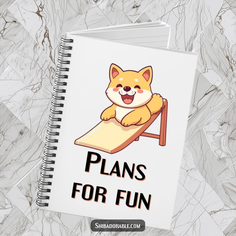 Funny Shiba Inu dog with a big smile sliding down a slide, featured on the cover of a notebook for inspired and happy note-taking.