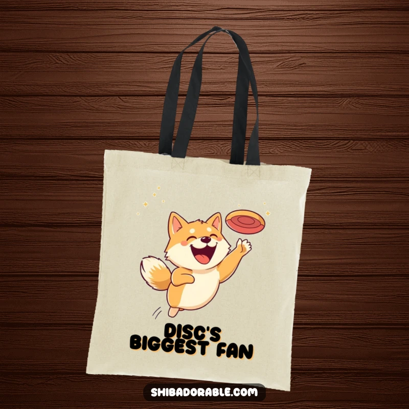 Funny tote bag featuring a Shiba Inu with a massive grin, captured mid-leap as it goes for a flying disc.